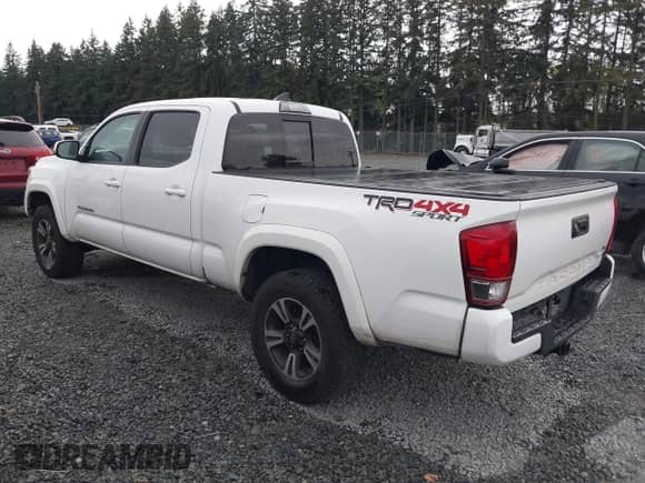 2017 Toyota Tacoma TRD Off Road z VIN 3TMDZ5BN2HM012821, wystawiony jako IAAI lot #43325557 z przebiegiem 278 781 mil mil oraz . Historia ofert i sprzedaży dostępna na DreamBid. Obrazek 3.