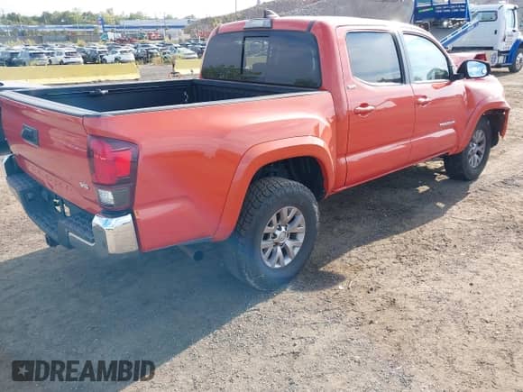 2018 Toyota Tacoma SR5 with VIN 5TFAZ5CN4JX064016, listed as a IAAI auction lot 43222144 with 74,935 mi miles and . Bid and sale history available at DreamBid. Image 4.