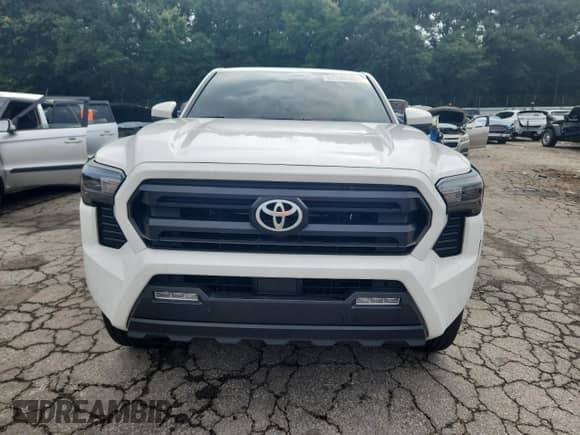 2024 Toyota Tacoma SR5 with VIN 3TYLB5JN2RT035281, listed as a Copart auction lot 69350095 with 9,907 mi miles and Salvage title. Bid and sale history available at DreamBid. Image 5.