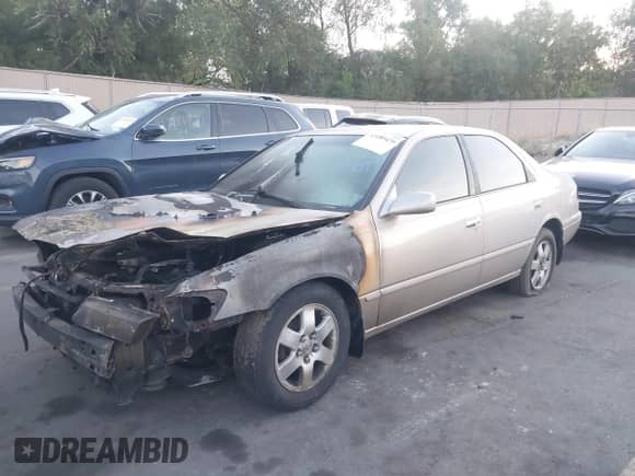 1997 Toyota Camry LE z VIN 4T1BG22KXVU787551, wystawiony jako IAAI lot #43189429 z przebiegiem Nie podano mil oraz . Historia ofert i sprzedaży dostępna na DreamBid. Obrazek 2.