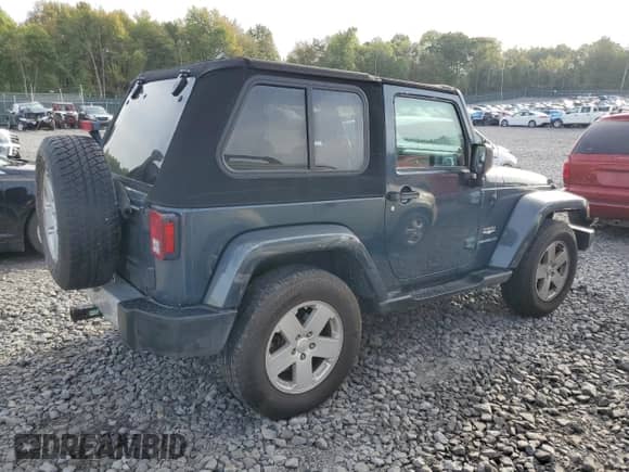 2008 Jeep Wrangler Sahara с VIN 1J8FA541X8L519597, выставлен на аукционе Copart как лот 83830965 с пробегом 141 463 миль миль и Списание • Salvage title. История ставок и продаж доступна на DreamBid. Изображение 3.