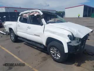 2018 Toyota Tacoma SR5 with VIN 5TFAZ5CN4JX068597, listed as a IAAI auction lot 42233349 with 95,411 mi miles and . Bid and sale history available at DreamBid. Image 1.