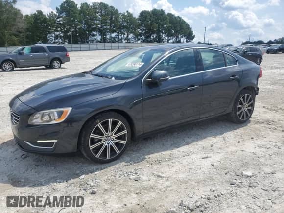 2015 Volvo S60 T6 Drive-E with VIN YV149MFK3F1349819, listed as a Copart auction lot 66590114 with 166,860 mi miles and Salvage title. Bid and sale history available at DreamBid. Image 1.