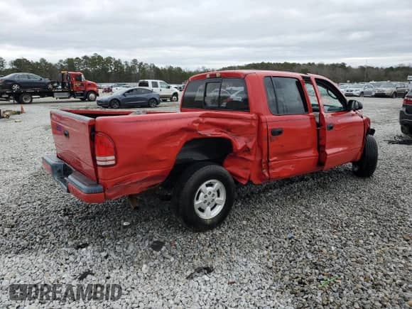 2002 Dodge Dakota Sport z VIN 1B7HL38X42S714766, wystawiony jako Copart lot #41376685 z przebiegiem Nie podano mil oraz Nie do naprawy • Non repairable. Historia ofert i sprzedaży dostępna na DreamBid. Obrazek 3.