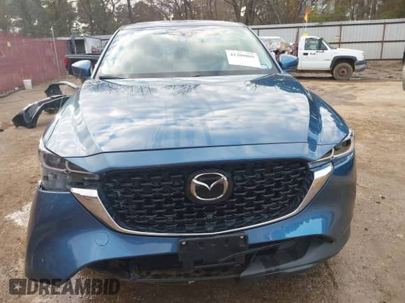 2023 Mazda CX-5 S Carbon Edition z VIN JM3KFBCM2P0235177, wystawiony jako IAAI lot #41209889 z przebiegiem 15 588 mil mil oraz . Historia ofert i sprzedaży dostępna na DreamBid. Obrazek 6.