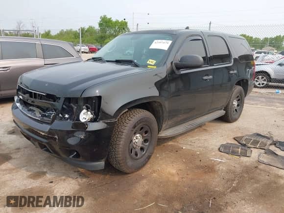 2014 Chevrolet Tahoe Commercial z VIN 1GNLC2E03ER212670, wystawiony jako IAAI lot #42397479 z przebiegiem 106 756 mil mil oraz . Historia ofert i sprzedaży dostępna na DreamBid. Obrazek 2.