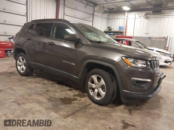 2018 Jeep Compass Latitude with VIN 3C4NJDBB7JT265897, listed as a IAAI auction lot 43349034 with 79,547 mi miles and . Bid and sale history available at DreamBid. Image 1.