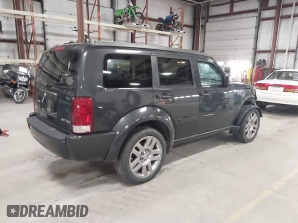 2010 Dodge Nitro Heat with VIN 1D4PT4GK4AW173980, listed as a IAAI auction lot 41842870 with 165,087 mi miles and . Bid and sale history available at DreamBid. Image 4.