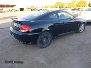 2006 Hyundai Tiburon GS z VIN KMHHM65DX6U217882, wystawiony jako IAAI lot #43576572 z przebiegiem 158 336 mil mil oraz . Historia ofert i sprzedaży dostępna na DreamBid. Obrazek 4.