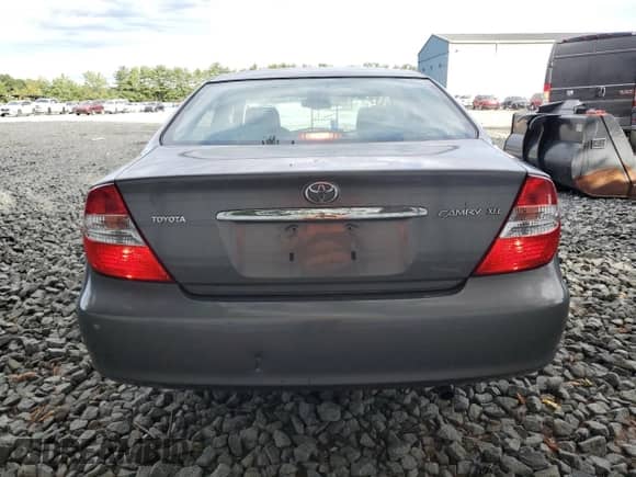 2002 Toyota Camry XLE z VIN 4T1BE30K72U609932, wystawiony jako Copart lot #69432835 z przebiegiem 92 299 mil mil oraz Szkoda całkowita • Salvage title. Historia ofert i sprzedaży dostępna na DreamBid. Obrazek 6.