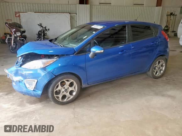 2011 Ford Fiesta SES with VIN 3FADP4FJ7BM129640, listed as a Copart auction lot 64300315 with 69,431 mi miles and Salvage title. Bid and sale history available at DreamBid. Image 1.