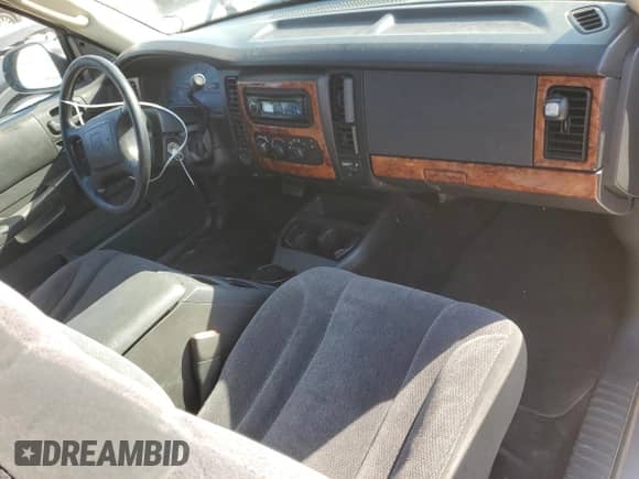 2003 Dodge Dakota с VIN 1D7HG12XX3S110986, выставлен на аукционе Copart как лот 77675734 с пробегом 108 529 миль миль и Списание • Salvage title. История ставок и продаж доступна на DreamBid. Изображение 8.