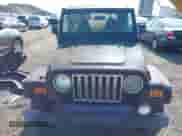 2002 Jeep Wrangler Sahara with VIN 1J4FA59S02P703627, listed as a IAAI auction lot 42815504 with 144,573 mi miles and . Bid and sale history available at DreamBid. Image 6.