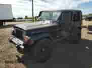 1998 Jeep Wrangler Sport z VIN 1J4FY19SXWP734488, wystawiony jako Copart lot #81896775 z przebiegiem 180 236 mil mil oraz Czysty tytuł • Clean title. Historia ofert i sprzedaży dostępna na DreamBid. Obrazek 1.