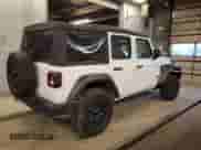 2024 Jeep Wrangler Sport S with VIN 1C4PJXDG9RW308614, listed as a Copart auction lot 84520434 with 4,985 mi miles and Salvage title. Bid and sale history available at DreamBid. Image 3.