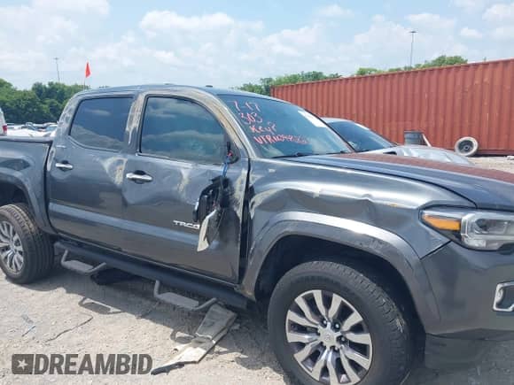 2023 Toyota Tacoma Limited with VIN 3TMEZ5CN0PM198960, listed as a IAAI auction lot 42791192 with 77,993 mi miles and . Bid and sale history available at DreamBid. Image 6.