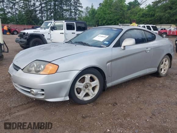 2003 Hyundai Tiburon GT с VIN KMHHN65F63U036899, выставлен на аукционе IAAI как лот 42148935 с пробегом 203 485 миль миль и . История ставок и продаж доступна на DreamBid. Изображение 2.