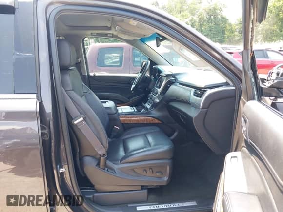 2015 Chevrolet Tahoe LTZ with VIN 1GNSKCKC2FR588524, listed as a IAAI auction lot 42851274 with 101,426 mi miles and . Bid and sale history available at DreamBid. Image 5.