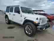 2023 Jeep Wrangler Sahara Altitude with VIN 1C4HJXEG5PW570629, listed as a Copart auction lot 80860234 with 15,121 mi miles and Salvage title. Bid and sale history available at DreamBid. Image 4.