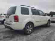 2014 Honda Pilot Touring with VIN 5FNYF4H97EB041584, listed as a Copart auction lot 66761435 with 121,127 mi miles and Salvage title. Bid and sale history available at DreamBid. Image 3.