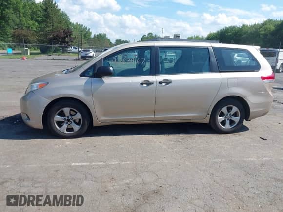 2014 Toyota Sienna L with VIN 5TDZK3DC6ES497292, listed as a IAAI auction lot 42634167 with 211,769 mi miles and . Bid and sale history available at DreamBid. Image 14.