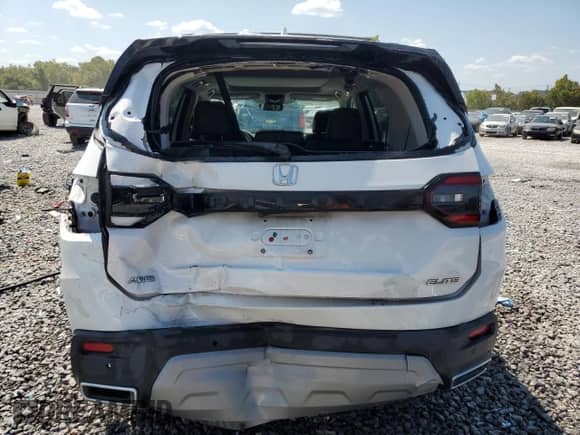 2023 Honda Pilot Elite with VIN 5FNYG1H81PB009610, listed as a Copart auction lot 71729585 with 55,144 mi miles and Salvage title. Bid and sale history available at DreamBid. Image 6.