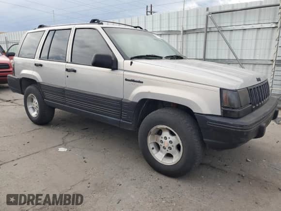 1995 Jeep Grand Cherokee Laredo with VIN 1J4GZ58S2SC703196, listed as a Copart auction lot 68571944 with 264,876 mi miles and Clean title. Bid and sale history available at DreamBid. Image 4.