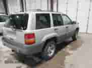 1996 Jeep Grand Cherokee Laredo z VIN 1J4GZ58S5TC293897, wystawiony jako IAAI lot #42435233 z przebiegiem 167 432 mil mil oraz . Historia ofert i sprzedaży dostępna na DreamBid. Obrazek 4.
