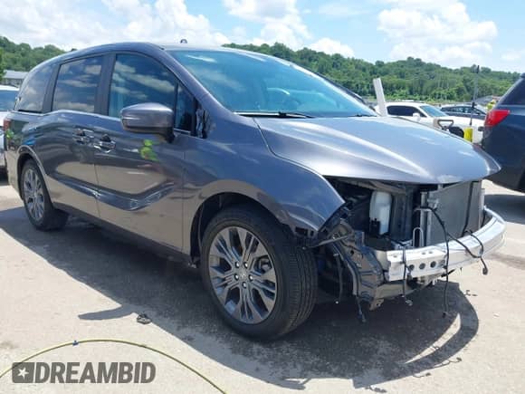 2025 Honda Odyssey Touring with VIN 5FNRL6H87SB009424, listed as a IAAI auction lot 42602484 with 14,823 mi miles and . Bid and sale history available at DreamBid. Image 1.