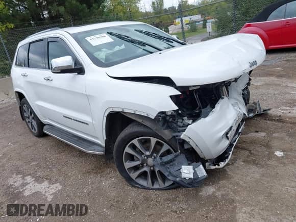 2017 Jeep Grand Cherokee Overland with VIN 1C4RJFCG8HC663780, listed as a IAAI auction lot 43290580 with 105,136 mi miles and . Bid and sale history available at DreamBid. Image 1.