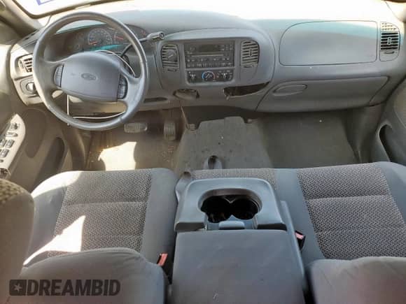 2002 Ford F-150 XLT с VIN 1FTRW07642KC90296, выставлен на аукционе Copart как лот 70596375 с пробегом 194 813 миль миль и Списание • Salvage title. История ставок и продаж доступна на DreamBid. Изображение 8.