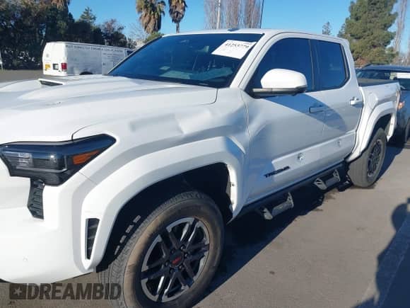 2024 Toyota Tacoma SR5 with VIN 3TMLB5JN8RM034034, listed as a IAAI auction lot 41253779 with 21,448 mi miles and . Bid and sale history available at DreamBid. Image 6.