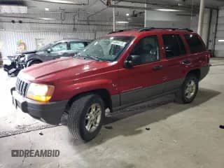 2002 Jeep Grand Cherokee Laredo with VIN 1J4GW48S52C229800, listed as a Copart auction lot 86864115 with 195,739 mi miles and Salvage title. Bid and sale history available at DreamBid. Image 1.