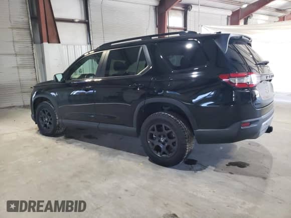 2023 Honda Pilot TrailSport с VIN 5FNYG1H63PB031249, выставлен на аукционе Copart как лот 85163934 с пробегом 12 058 миль миль и Списание • Salvage title. История ставок и продаж доступна на DreamBid. Изображение 2.