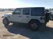 2024 Jeep Wrangler Sahara с VIN 1C4PJXEG7RW303233, выставлен на аукционе Copart как лот 69033175 с пробегом 21 650 миль миль и Списание • Salvage title. История ставок и продаж доступна на DreamBid. Изображение 2.