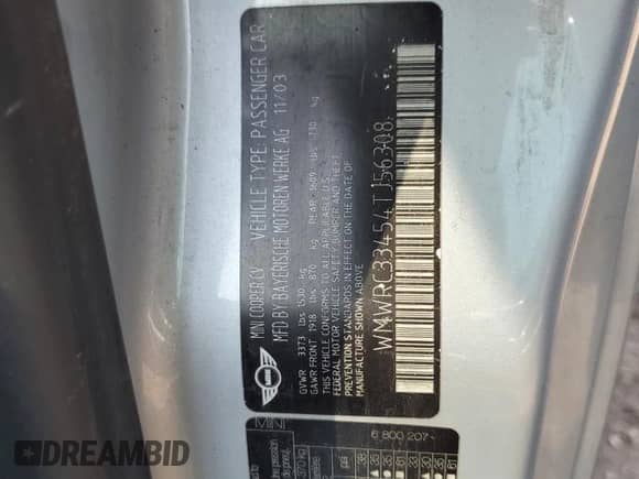 2004 MINI Hardtop with VIN WMWRC33454TJ56308, listed as a Copart auction lot 59690865 with 99,374 mi miles and Salvage title. Bid and sale history available at DreamBid. Image 12.
