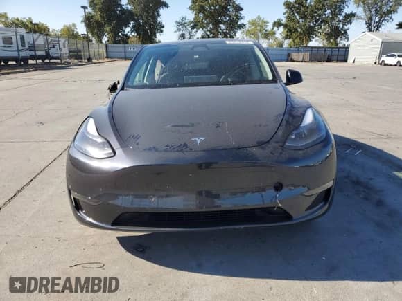 2024 Tesla Model Y Long Range with VIN 7SAYGDEE1RF073891, listed as a Copart auction lot 65612434 with 4,448 mi miles and Salvage title. Bid and sale history available at DreamBid. Image 5.