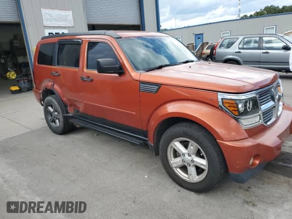 2007 Dodge Nitro SLT with VIN 1D8GU58K57W609390, listed as a Copart auction lot 71275105 with 166,051 mi miles and Salvage title. Bid and sale history available at DreamBid. Image 4.