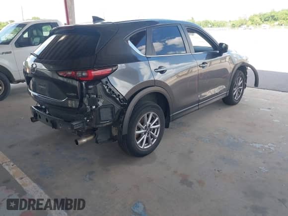2023 Mazda CX-5 S Carbon Edition z VIN JM3KFBCM8P0251108, wystawiony jako IAAI lot #42171155 z przebiegiem 45 551 mil mil oraz . Historia ofert i sprzedaży dostępna na DreamBid. Obrazek 4.