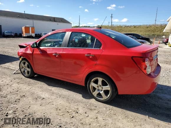 2015 Chevrolet Sonic LTZ with VIN 1G1JE5SB1F4201935, listed as a Copart auction lot 82342415 with 111,922 mi miles and Salvage title. Bid and sale history available at DreamBid. Image 2.