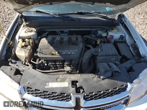 2013 Dodge Avenger SE z VIN 1C3CDZAB3DN730830, wystawiony jako Copart lot #70456914 z przebiegiem 140 616 mil mil oraz Szkoda całkowita • Salvage title. Historia ofert i sprzedaży dostępna na DreamBid. Obrazek 12.