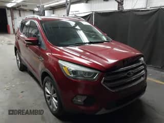 2017 Ford Escape Titanium z VIN 1FMCU0J95HUC51210, wystawiony jako IAAI lot #43185339 z przebiegiem 82 388 mil mil oraz . Historia ofert i sprzedaży dostępna na DreamBid. Obrazek 1.