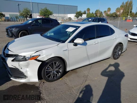 2021 Toyota Camry Hybrid XLE with VIN 4T1F31AK3MU567000, listed as a IAAI auction lot 43279629 with 132,796 mi miles and . Bid and sale history available at DreamBid. Image 2.