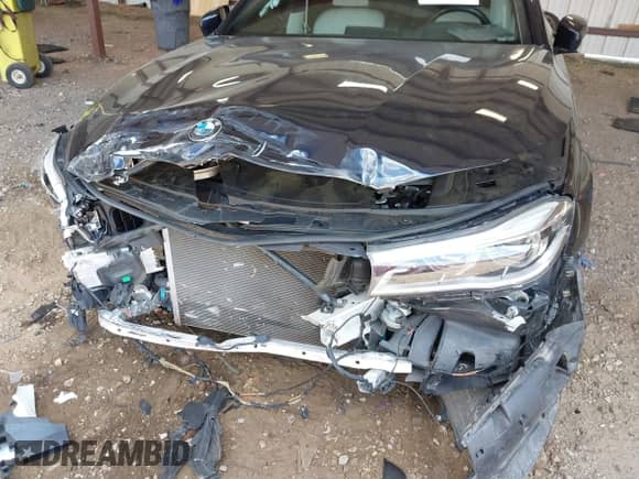 2019 BMW 7 Series 750i with VIN WBA7F0C55KGM24477, listed as a IAAI auction lot 42883182 with 76,932 mi miles and . Bid and sale history available at DreamBid. Image 6.