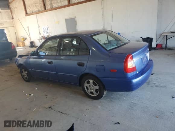 2000 Hyundai Accent z VIN KMHCG45G6YU066218, wystawiony jako Copart lot #84948715 z przebiegiem 110 059 mil mil oraz Szkoda całkowita • Salvage title. Historia ofert i sprzedaży dostępna na DreamBid. Obrazek 2.