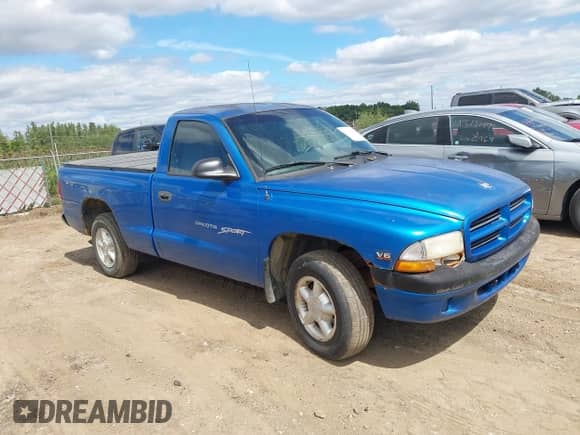 1999 Dodge Dakota SLT z VIN 1B7FL26X1XS247267, wystawiony jako IAAI lot #43113508 z przebiegiem 70 956 mil mil oraz . Historia ofert i sprzedaży dostępna na DreamBid. Obrazek 1.