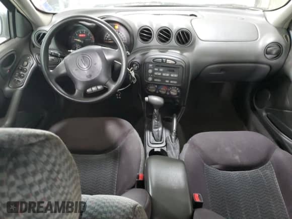 2004 Pontiac Grand Am SE1 with VIN 1G2NF52E84M669999, listed as a Copart auction lot 70597345 with 186,803 mi miles and Salvage title. Bid and sale history available at DreamBid. Image 8.