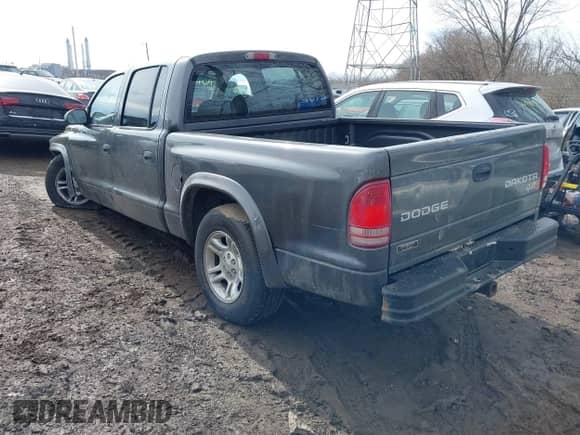 2004 Dodge Dakota Sport z VIN 1D7HL38K64S651151, wystawiony jako IAAI lot #41640874 z przebiegiem 194 771 mil mil oraz . Historia ofert i sprzedaży dostępna na DreamBid. Obrazek 3.