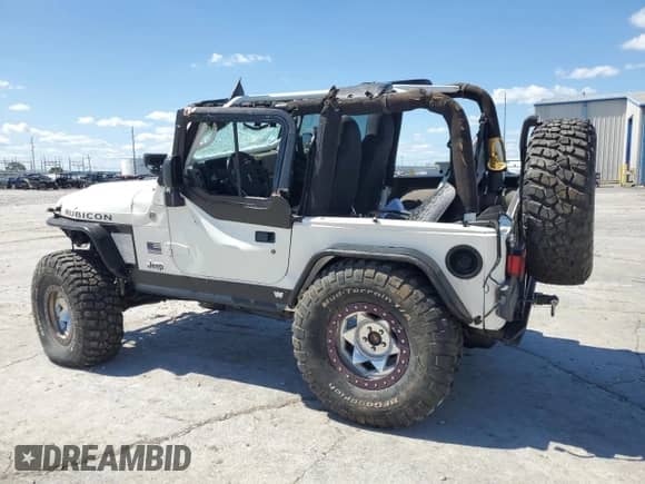 2005 Jeep Wrangler Rubicon with VIN 1J4FA69S85P321548, listed as a Copart auction lot 58896845 with 57,309 mi miles and Salvage title. Bid and sale history available at DreamBid. Image 2.