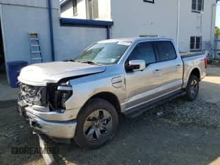 2023 Ford F-150 Lightning Pro with VIN 1FT6W1EV1PWG08782, listed as a Copart auction lot 80059795 with 18,728 mi miles and Salvage title. Bid and sale history available at DreamBid. Image 1.